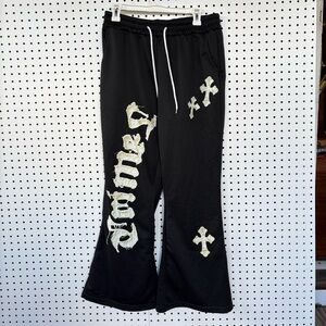 Manfinity Unisex Flare Leg Sweatpant
With Gothic Cross